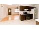 Open kitchen and living room concept features hardwood floors and stainless steel appliances at 6423 Boxwood St, Brooksville, FL 34602