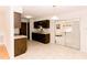 Classic kitchen with wooden cabinets, tile floors and granite countertops at 6423 Boxwood St, Brooksville, FL 34602