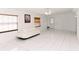 Bright living room features tile flooring, large windows and comfortable seating at 6423 Boxwood St, Brooksville, FL 34602