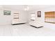 Bright living room with tile flooring, ceiling fan and natural light from windows at 6423 Boxwood St, Brooksville, FL 34602