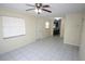 Open-concept living area with tiled floors, natural light, and access to the kitchen, perfect for entertaining at 6508 Los Altos Way, Tampa, FL 33634