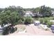 Backyard featuring a shed and partially fenced yard, with mature trees providing shade and privacy at 6514 La Mesa Cir, Tampa, FL 33634