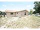 Lawn area view shows the exterior of the home at 6514 La Mesa Cir, Tampa, FL 33634