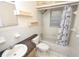 Classic bathroom with shower-tub combination, single sink vanity, and updated fixtures at 6514 La Mesa Cir, Tampa, FL 33634