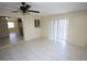 Open living room boasts tiled floors, neutral walls, and access to the kitchen area at 6514 La Mesa Cir, Tampa, FL 33634