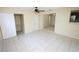 Open living room boasts tile flooring, ample closet space and leads to the kitchen at 6514 La Mesa Cir, Tampa, FL 33634