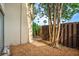 Private backyard offers a tranquil outdoor experience, beautiful plants, and a new privacy fence at 775 N Village N Dr # 106, St Petersburg, FL 33716