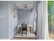 Cozy dining area features a ceiling fan, natural light, and comfortable seating for a pleasant dining experience at 775 N Village N Dr # 106, St Petersburg, FL 33716