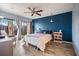 Comfortable bedroom with sliding doors to the yard, ceiling fan, and stylish decor elements at 775 N Village N Dr # 106, St Petersburg, FL 33716
