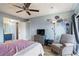Well-lit main bedroom offers easy access to the en-suite bath and views to the yard at 775 N Village N Dr # 106, St Petersburg, FL 33716