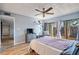Serene bedroom offering backyard views, wood-look floors, and a comfortable sitting area at 775 N Village N Dr # 106, St Petersburg, FL 33716