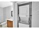 Bathroom featuring a washer and dryer unit, modern vanity, and updated tiling at 776 116Th N Ave # 1110, St Petersburg, FL 33716