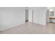 Bedroom featuring neutral tile floors and a closet; vanity area is adjacent at 776 116Th N Ave # 1110, St Petersburg, FL 33716