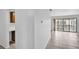 Open living space with neutral tile flooring and sliding glass doors to a balcony, offering natural light at 776 116Th N Ave # 1110, St Petersburg, FL 33716