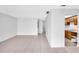Spacious living area showcasing tile floors, fresh paint, and an open layout connecting to the kitchen at 776 116Th N Ave # 1110, St Petersburg, FL 33716