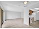Bright living room with tile floors and an adjacent kitchen, creating an open and airy atmosphere at 776 116Th N Ave # 1110, St Petersburg, FL 33716