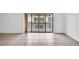 Bright living room featuring neutral tile floors and sliding glass doors to the balcony at 776 116Th N Ave # 1110, St Petersburg, FL 33716