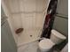 Shower stall in a well-lit bathroom with gray accents, a modern shower head, and a low seat at 800 Cove Cay Dr # 4F, Clearwater, FL 33760