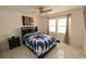 Bedroom showcasing a ceiling fan, skateboard decor, two large windows, and a queen-sized bed at 800 Cove Cay Dr # 4F, Clearwater, FL 33760