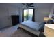 A bright bedroom with access to a screened-in patio with a view at 800 Cove Cay Dr # 4F, Clearwater, FL 33760
