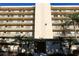 Beautiful condominium building with lush tropical landscaping and a grand entrance at 800 Cove Cay Dr # 4F, Clearwater, FL 33760