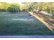 Aerial view of lush, green community park with mature trees and walking path at 800 Cove Cay Dr # 4F, Clearwater, FL 33760