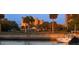 Picturesque waterfront view showcasing lush landscaping, nearby golf course, and docked boats at 800 Cove Cay Dr # 4F, Clearwater, FL 33760