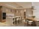 Modern kitchen with an island, seating, updated appliances, and wine storage at 805 S Gulfview Blvd # 506A, Clearwater, FL 33767