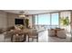 Bright living room with water view and dining area at 805 S Gulfview Blvd # 506A, Clearwater, FL 33767