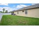 A well-manicured lawn complements the backyard's pool area and perimeter fence at 8511 White Poplar Dr, Riverview, FL 33578