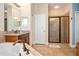 Bathroom featuring a glass enclosed shower, garden tub, granite countertop, and tiled floors at 8511 White Poplar Dr, Riverview, FL 33578