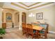 Dining room features an open layout, stylish chandelier, and easy access to other living spaces at 8511 White Poplar Dr, Riverview, FL 33578