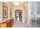 Grand foyer with tiled floors, arched doorways, and decorative niches for displaying art at 8511 White Poplar Dr, Riverview, FL 33578