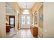 Welcoming foyer boasts high ceilings, arched doorways, and elegant decor, setting a sophisticated tone at 8511 White Poplar Dr, Riverview, FL 33578