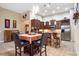 Charming kitchen with modern stainless steel appliances, granite countertops, and a breakfast bar with seating at 8511 White Poplar Dr, Riverview, FL 33578