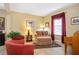 Comfortable living room featuring cozy seating, a bright window, and stylish decor at 8511 White Poplar Dr, Riverview, FL 33578