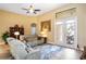 Cozy living room with sliding doors, a ceiling fan, and an open design for easy access to the outdoor patio at 8511 White Poplar Dr, Riverview, FL 33578