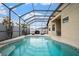 A spacious screened-in pool and patio perfect for outdoor entertaining and relaxation at 8511 White Poplar Dr, Riverview, FL 33578