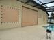 Backyard patio with pool, covered with hurricane protection screen at 8511 White Poplar Dr, Riverview, FL 33578