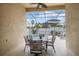 Covered patio featuring outdoor seating, a ceiling fan, and pool views at 8511 White Poplar Dr, Riverview, FL 33578