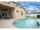 A stunning screened-in pool features elegant tile and a patio with comfortable seating at 8511 White Poplar Dr, Riverview, FL 33578