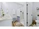 Modern bathroom featuring double sinks, a glass-enclosed shower with elegant tile work, and a toilet at 9149 Willmington Blvd, Englewood, FL 34224
