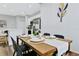 Elegant dining room space with modern decor, adjacent to the kitchen with stainless steel appliances at 9149 Willmington Blvd, Englewood, FL 34224