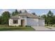 Charming one-story home with a two-car garage, well-manicured lawn and inviting front entryway at 9565 Runaway Breeze Dr, Land O Lakes, FL 34637