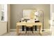 Bright and modern office space with a light wood desk, comfortable chair, and stylish decor at 9565 Runaway Breeze Dr, Land O Lakes, FL 34637
