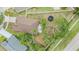 Aerial view of property showcasing backyard, surrounding neighborhood, and proximity to roads at 9712 White Barn Way, Riverview, FL 33569