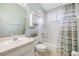 Cozy bathroom with a tub and shower, neutral color scheme and vanity at 9712 White Barn Way, Riverview, FL 33569