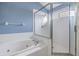 Bathroom featuring a soaking tub and a separate glass-enclosed shower stall at 9712 White Barn Way, Riverview, FL 33569