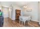 Cozy dining room with hardwood floors, a vintage hutch, and seating for four at 9712 White Barn Way, Riverview, FL 33569