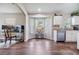 Sunlit kitchen area with hardwood floors and stainless steel dishwasher at 9712 White Barn Way, Riverview, FL 33569
